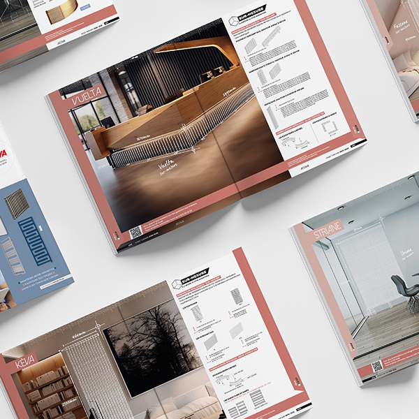 Several design catalogs spread across a white surface, displaying modern interiors and furniture layouts opposite technical pages.